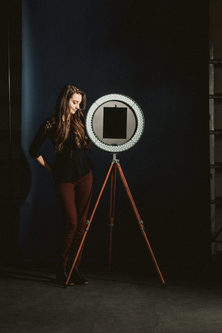 a woman stands next to her Gifyyy Photobooth